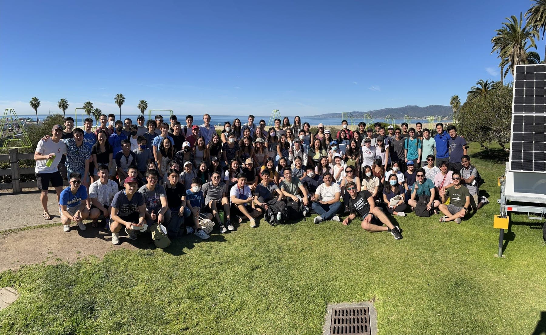 A large Grace on Campus group gathered outdoors by the ocean