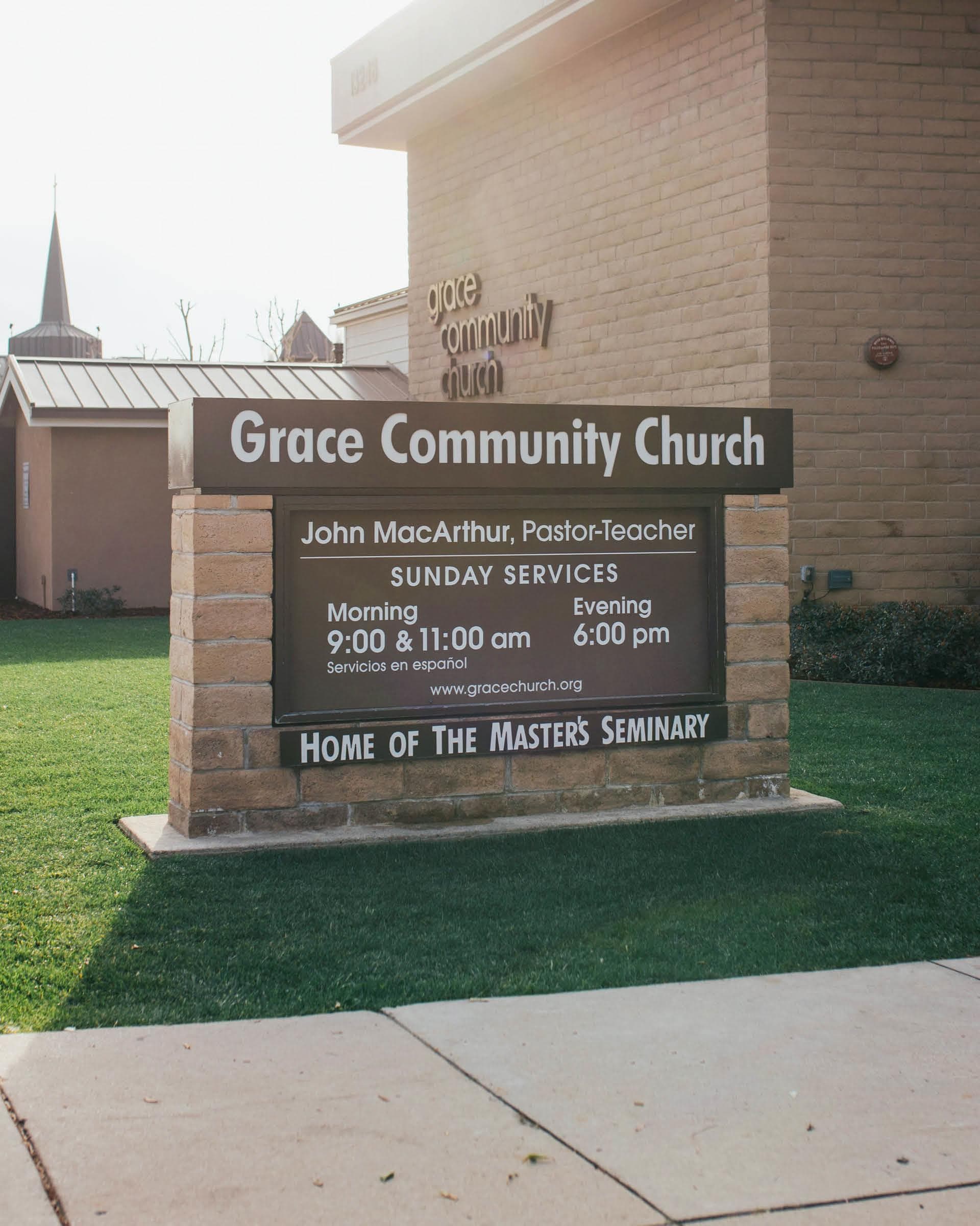 Grace Community Church campus entrance sign with Sunday service times